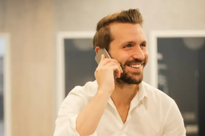 man using smartphone on chair